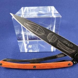 Deejo Tatoo: Ocean black titanium coated blade with Galleon tattoo and coralwood handle knives for sale