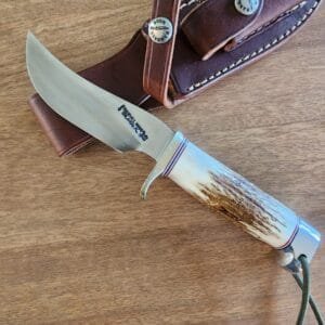 Randall Made Model 22-4 5/8 Outdoorsman in Stainless Steel W/ Nickel silver hilt, Stag handle, and crow's beak aluminum butt cap.