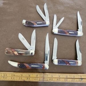 Limited Edition Winchester Collector's Edition Knife Set, Stainless steel blade with match strike pulls and brown checkered bone. (Set of 5) knives for sale